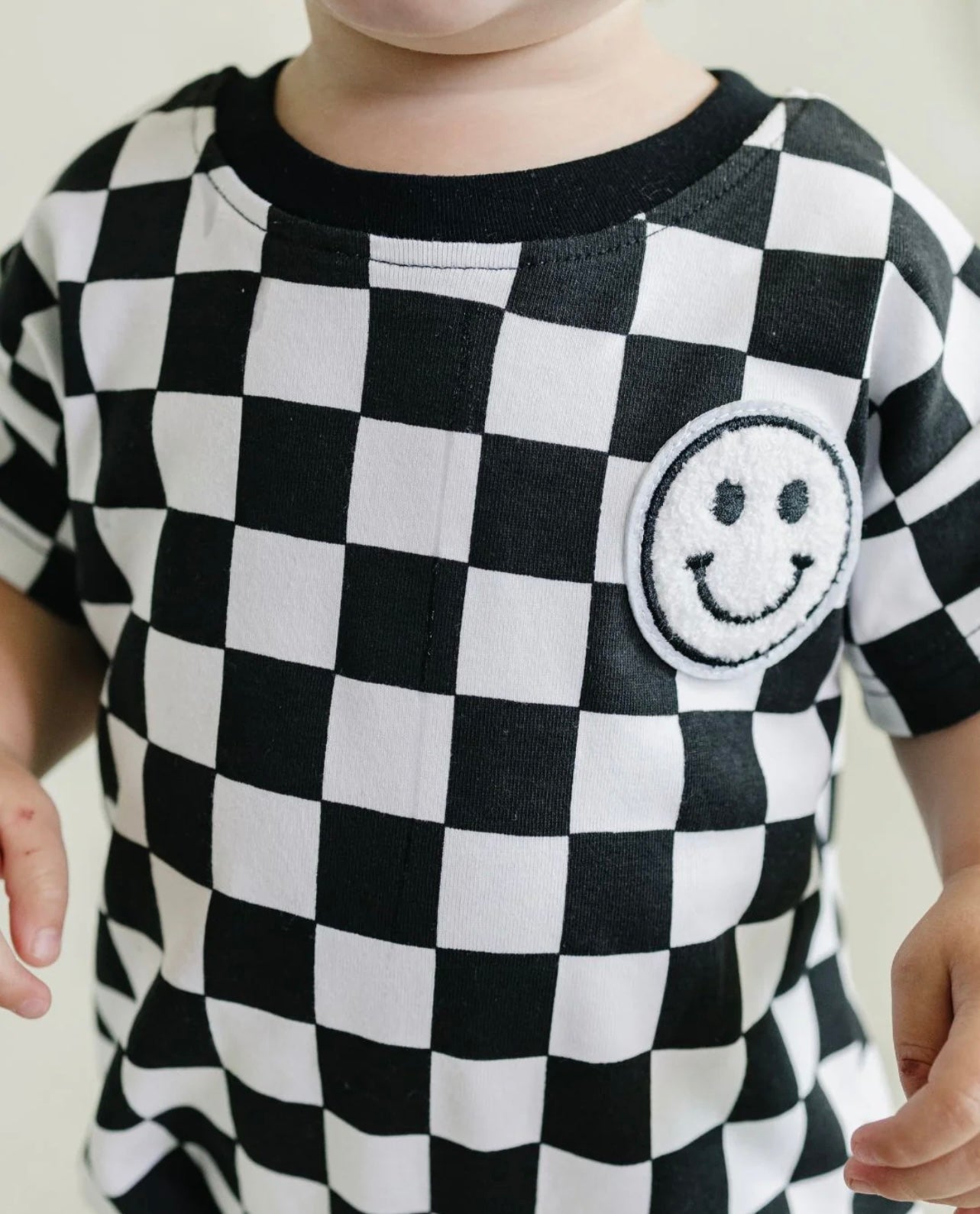 Checkered smiley | bubble romper